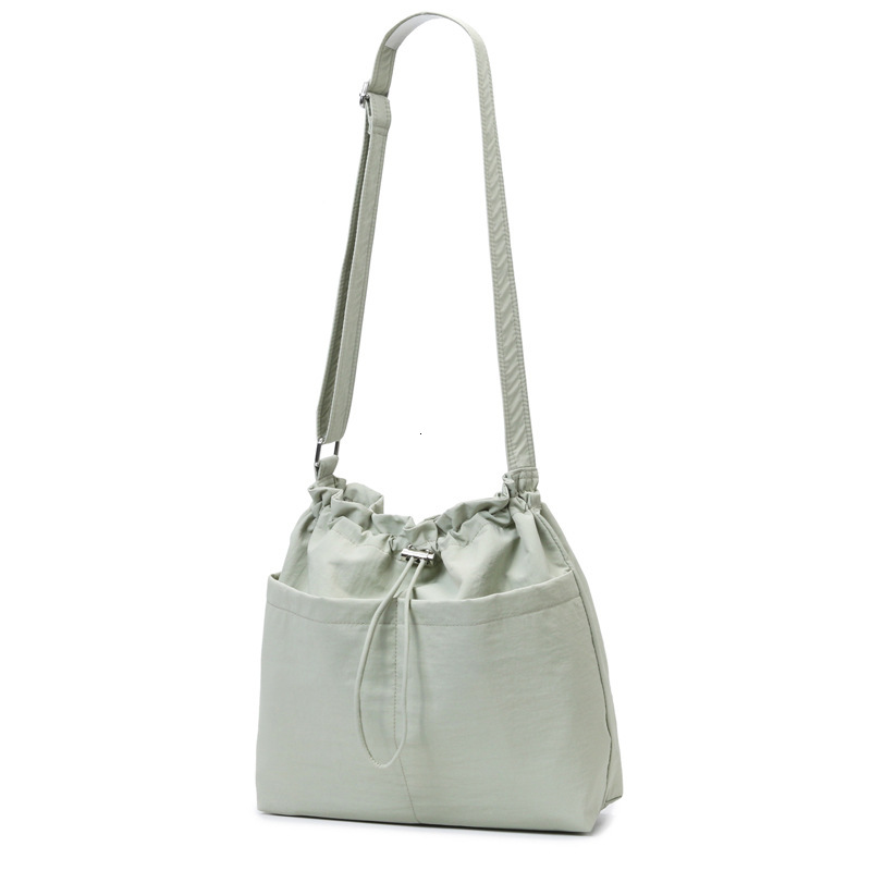 Flat Solid Color Drawstring Leisure Bag 2025 New Fashion Designer Popular High quality Handbag Commuting Shoulder Bag