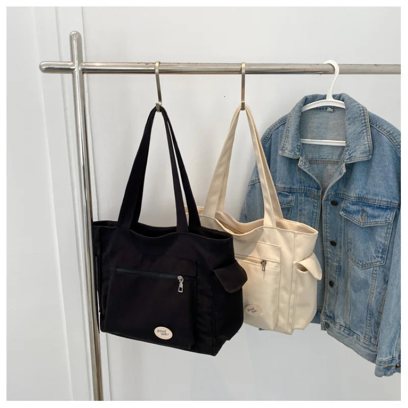 Womens bag fashionable large capacity student Oxford canvas handbag Mom casual shopping armpit multifunctional 250304
