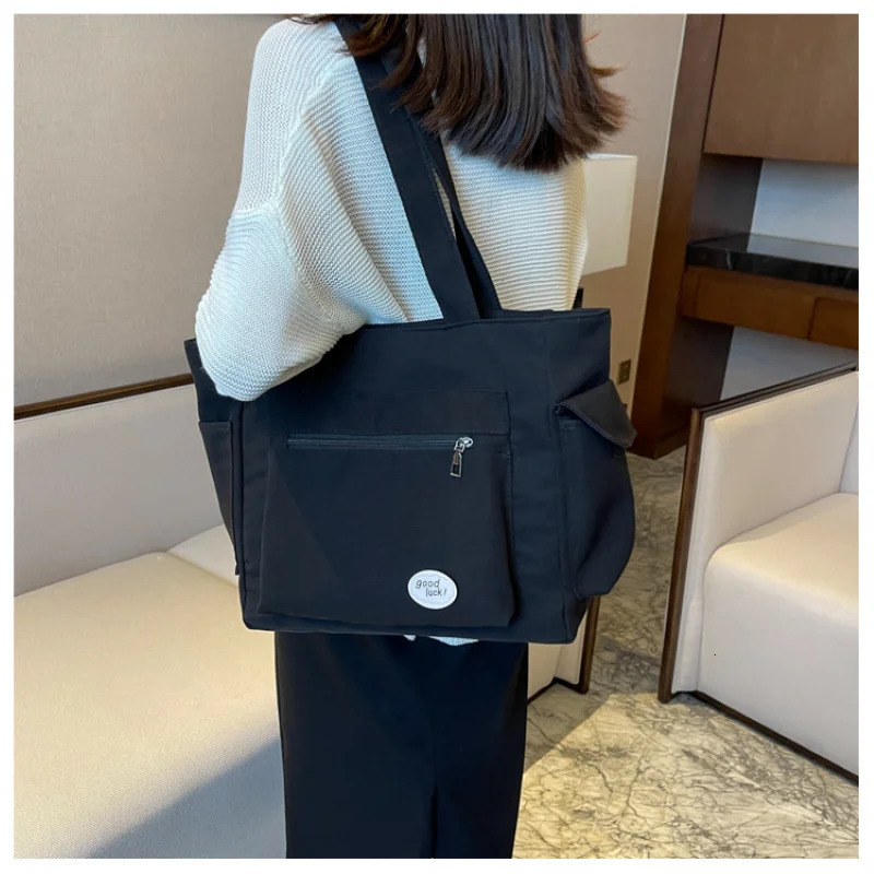 Womens bag fashionable large capacity student Oxford canvas handbag Mom casual shopping armpit multifunctional 250304