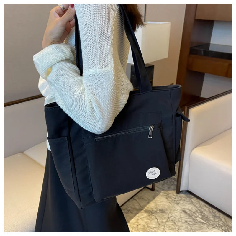 Womens bag fashionable large capacity student Oxford canvas handbag Mom casual shopping armpit multifunctional 250304