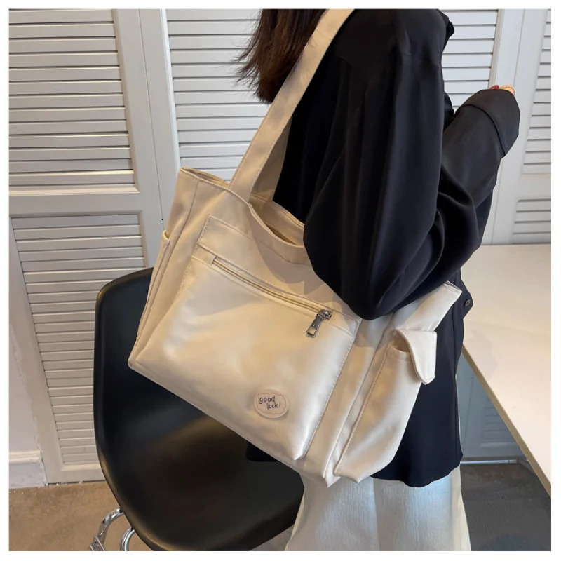 Womens bag fashionable large capacity student Oxford canvas handbag Mom casual shopping armpit multifunctional 250304