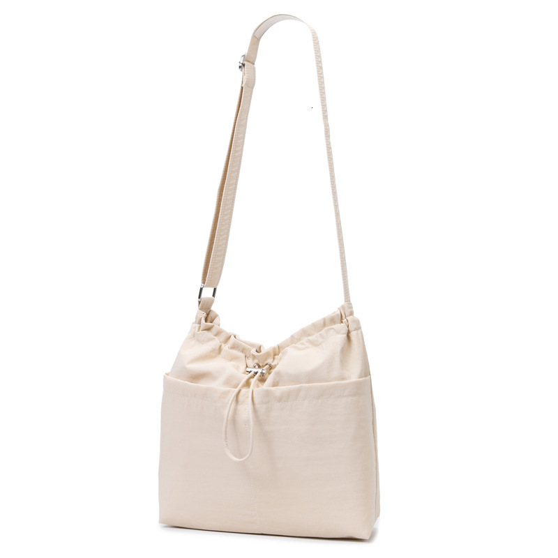 Flat Solid Color Drawstring Leisure Bag 2025 New Fashion Designer Popular High quality Handbag Commuting Shoulder Bag
