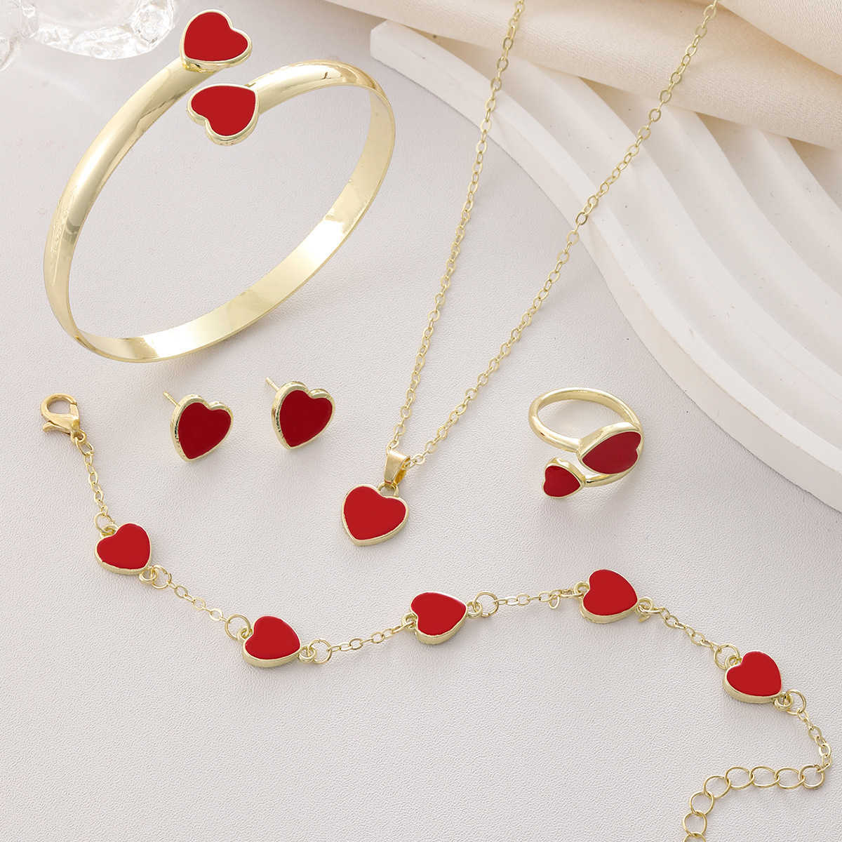 Hot selling Love Jewelry Set Xiyin Peach Heart Bracelet Bracelet Earnail Necklace Ring Jewelry W250312