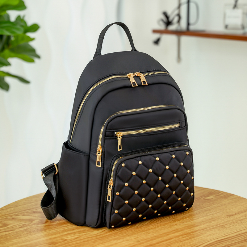 2025 Texture Rivet Backpack Large Capacity Simple Women s Diamond Grid Fashion Designer Summer Backpack New Outdoor Leisure Storage Bag Wallet Handbag