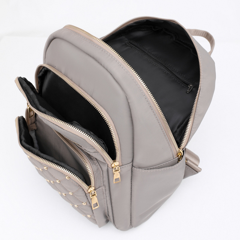 2025 Texture Rivet Backpack Large Capacity Simple Women s Diamond Grid Fashion Designer Summer Backpack New Outdoor Leisure Storage Bag Wallet Handbag