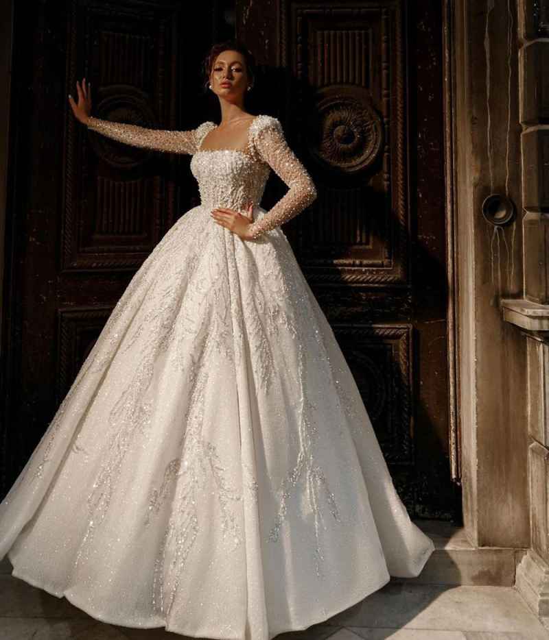 Elegant A e Women Wedding Sheer Neck Long Sleeves Backless Bridal Gowns Sequins Pearls Sweep Train Dress Custom Made