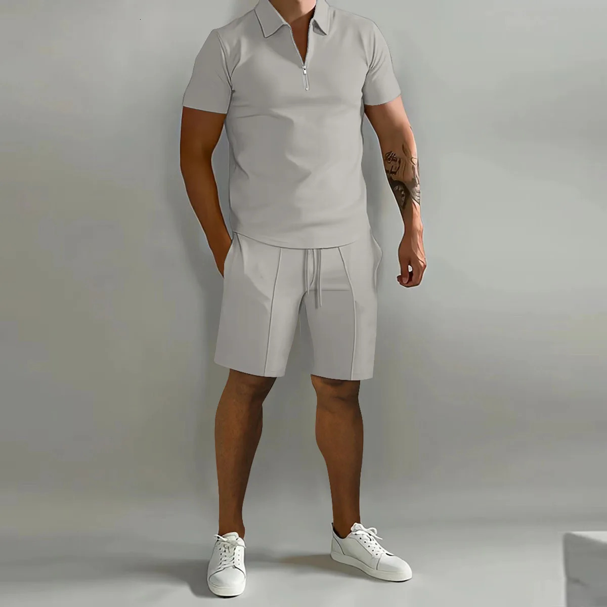 Mens solid color polo shirt collar vertical striped pants short sleeves sporty and casual loose fashionable mens clothing 250313