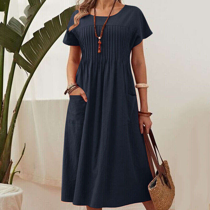 European and American women's long skirt solid color round neck pocket pleated short sleeved cotton en dress 2025 temperament versatile new trend
