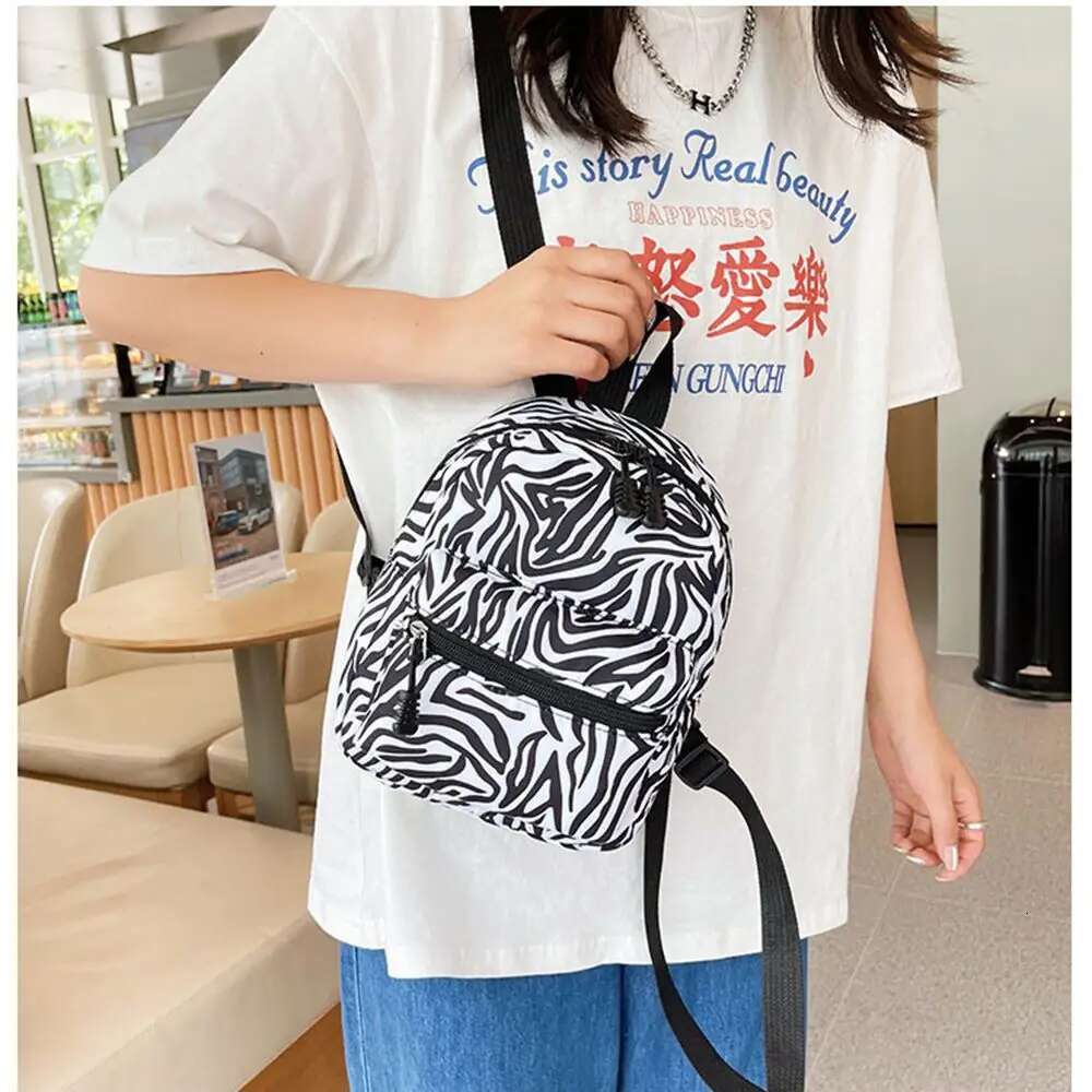 2025 Summer New Mini Fashion Designer Women s Backpack Leisure Backpack Outdoor Travel Bag Handbag Makeup Storage Bag