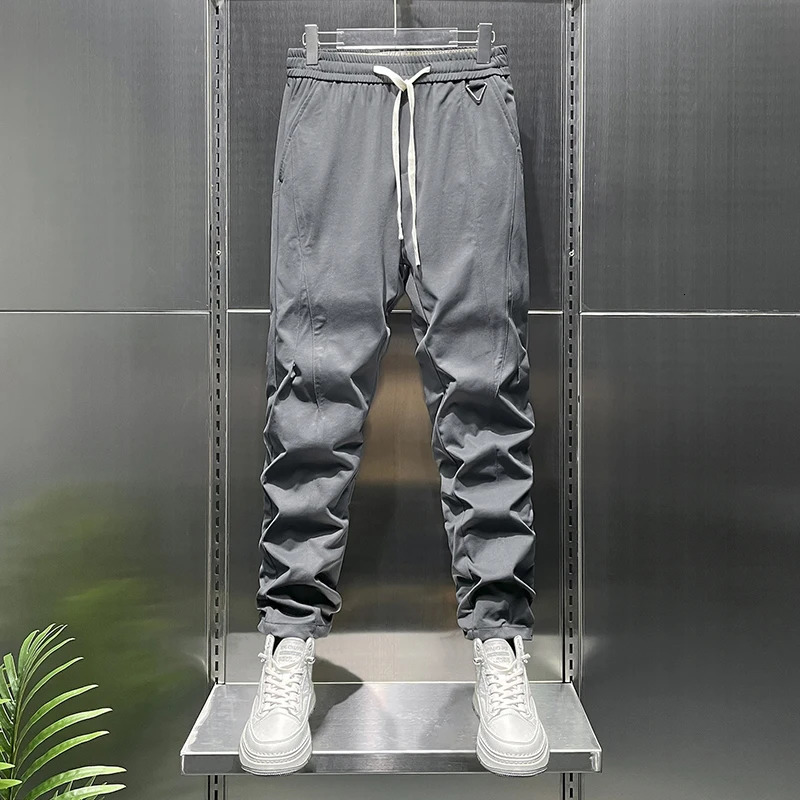 Summer tapered lightweight business casual pants suitable for men with elastic waist loose knit and fit 250313