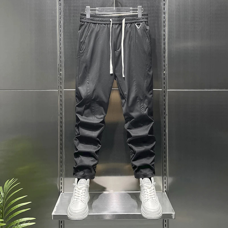 Summer tapered lightweight business casual pants suitable for men with elastic waist loose knit and fit 250313