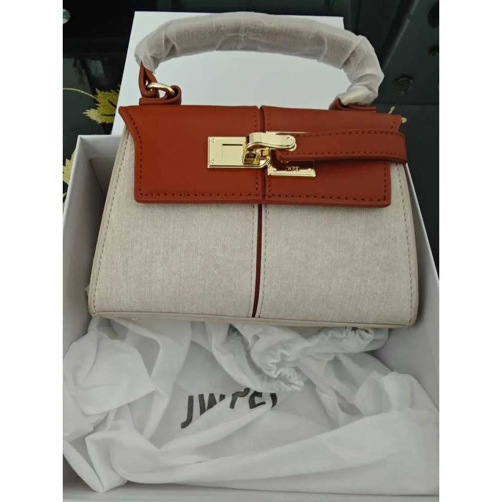 2025 NEW 2025 JW PEI Trapezoidal Leather Wens Bag Versatile hot Crossbody Fiable Niche Handbag Top-handle Handbags shoulder leather Y250313