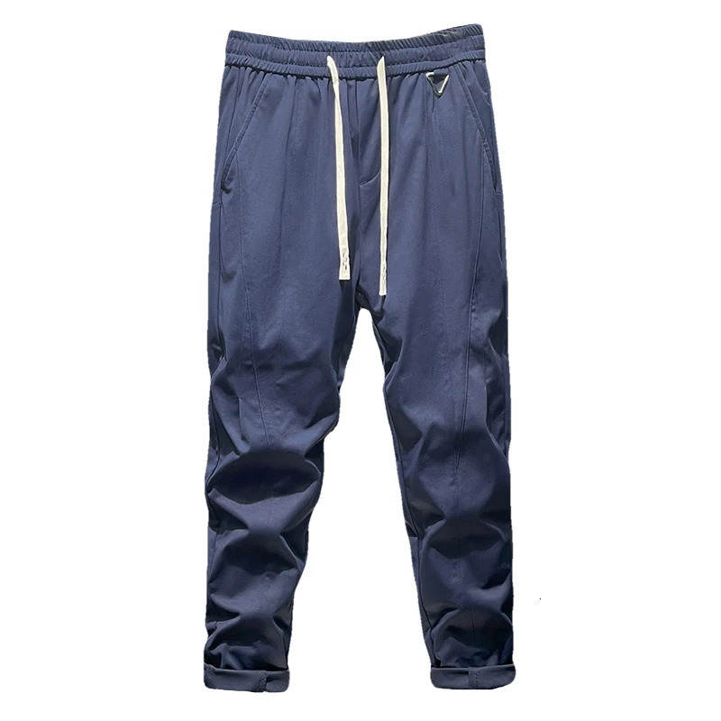 Summer tapered lightweight business casual pants suitable for men with elastic waist loose knit and fit 250313