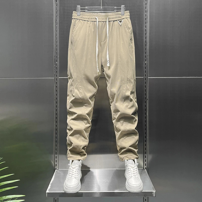 Summer tapered lightweight business casual pants suitable for men with elastic waist loose knit and fit 250313