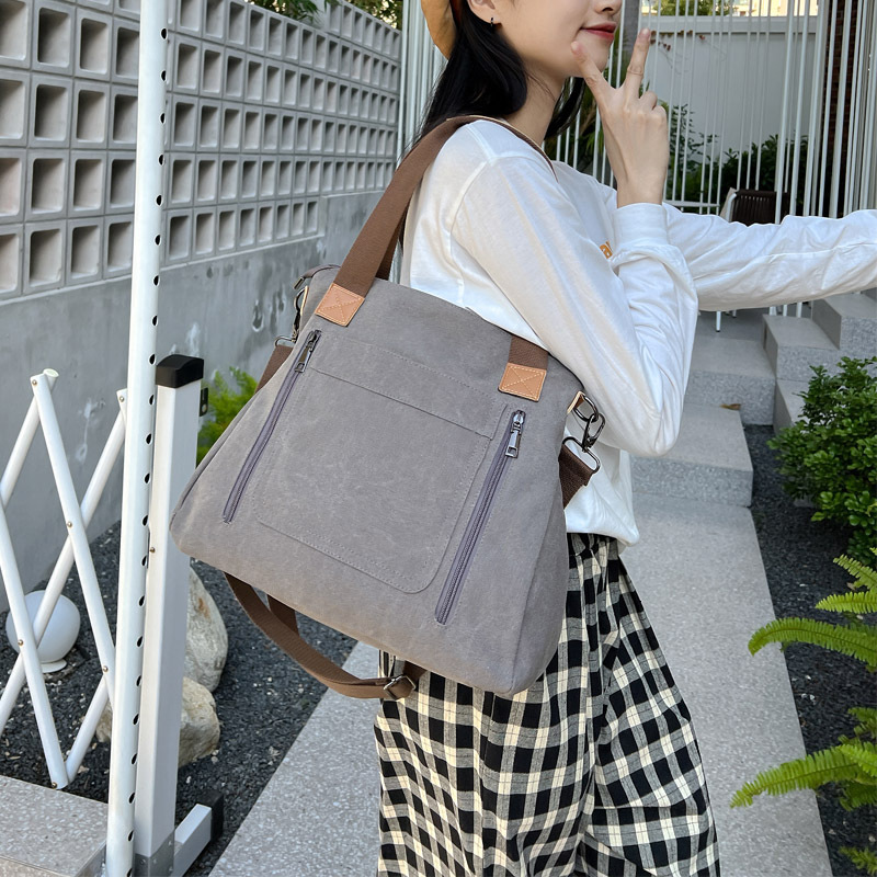 Leisure backpack Commuter Handheld One Shoulder Crossbody Trendy Women's Large Capacity Multi compartment Canvas designer bag