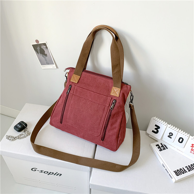 Leisure backpack Commuter Handheld One Shoulder Crossbody Trendy Women's Large Capacity Multi compartment Canvas designer bag