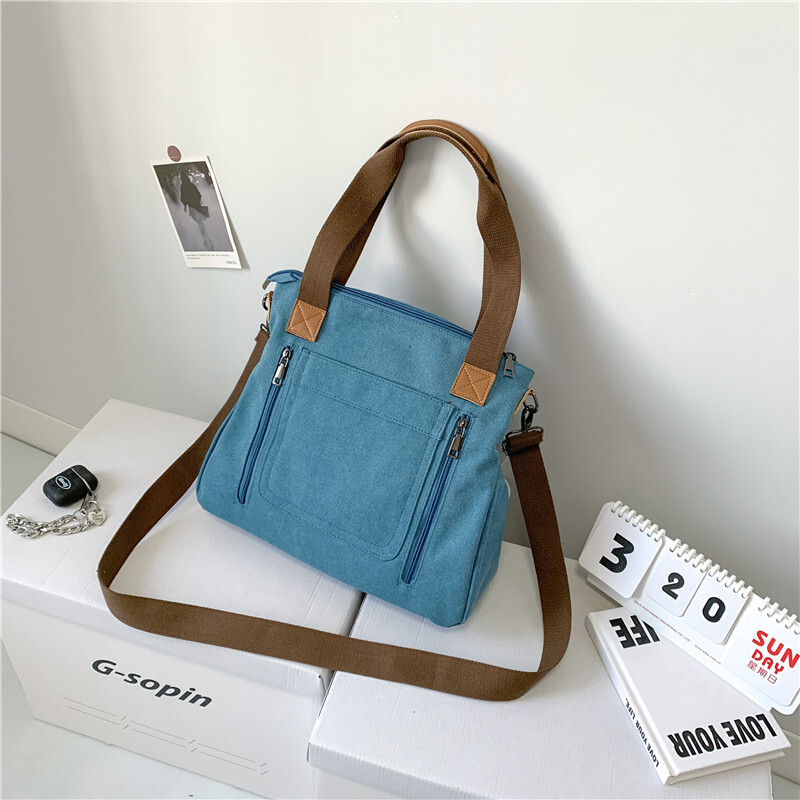 Leisure backpack Commuter Handheld One Shoulder Crossbody Trendy Women's Large Capacity Multi compartment Canvas designer bag