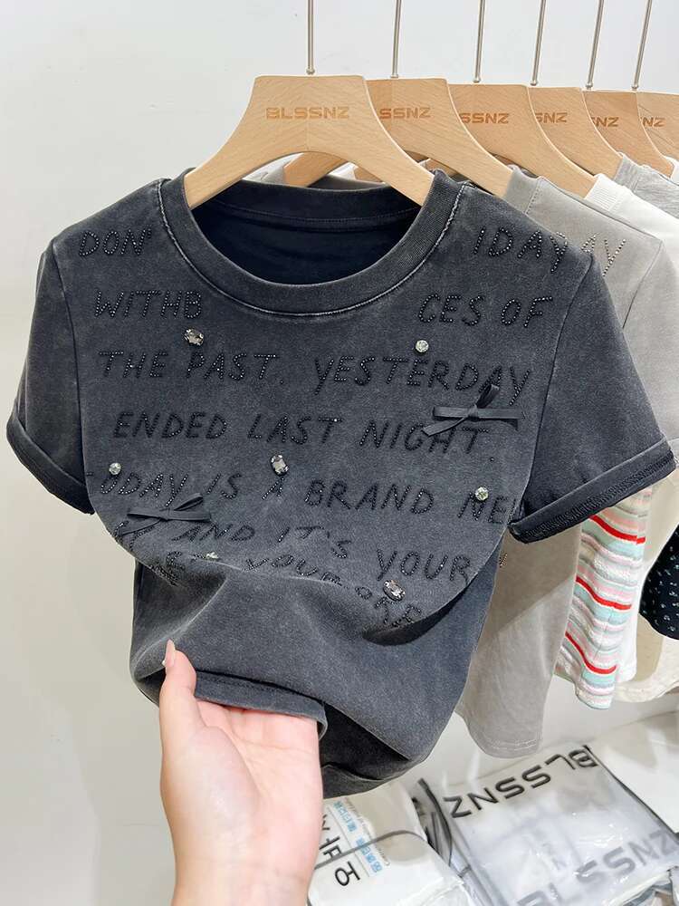 2025 New Women's Designer Fashion Heavy Embroidery Hot Diamond Letter Bow Round Neck Loose Short Sleeve T-shirt4