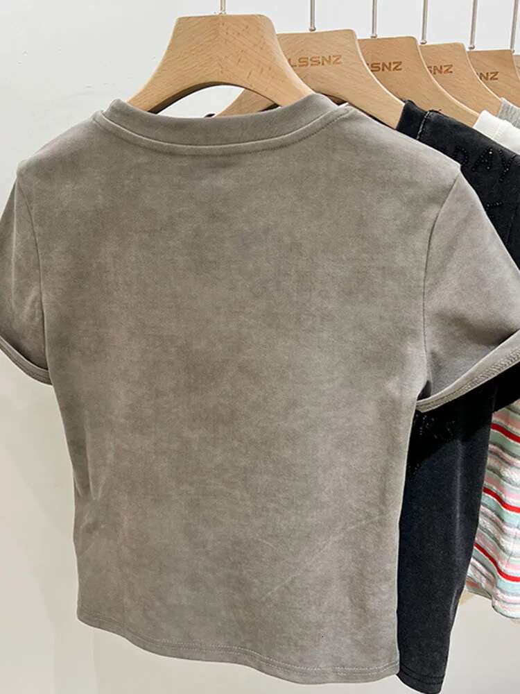 2025 New Women's Designer Fashion Heavy Embroidery Hot Diamond Letter Bow Round Neck Loose Short Sleeve T-shirt4