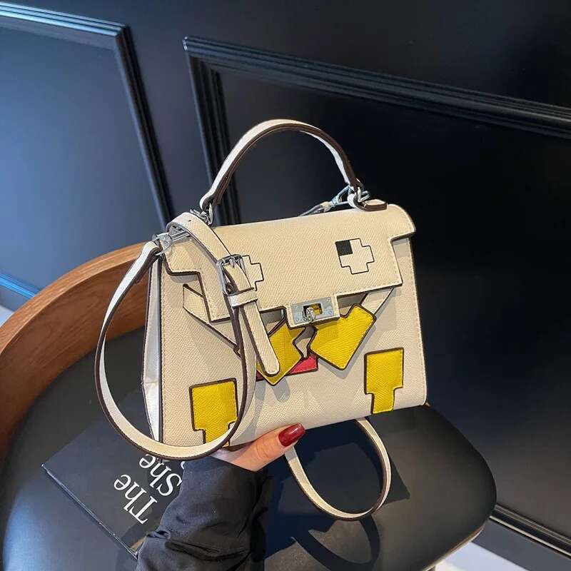 2025 New Platinum High-End Splicing Portable Women's Kelly Shoulder Small Square Versatile Doll Niche Bag