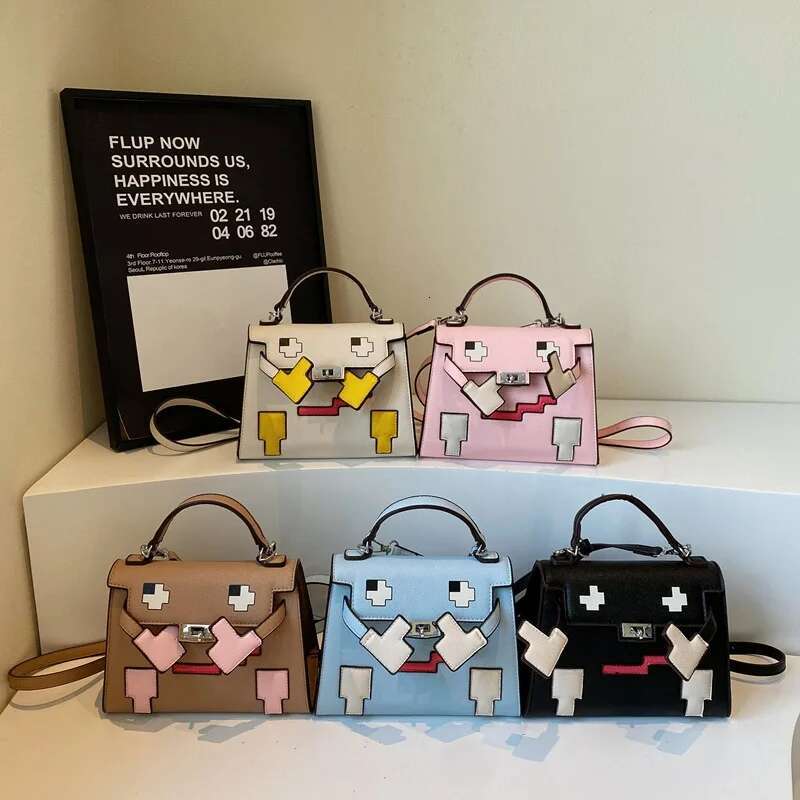 2025 New Platinum High-End Splicing Portable Women's Kelly Shoulder Small Square Versatile Doll Niche Bag