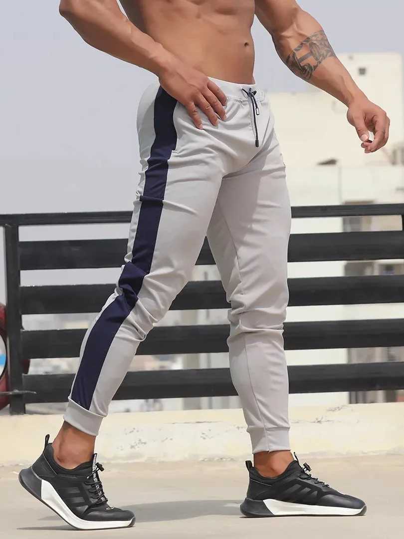 New mens color matching sports pants for running fitness leisure slim feet jogging pants cross-border between Europe and the United States W250318