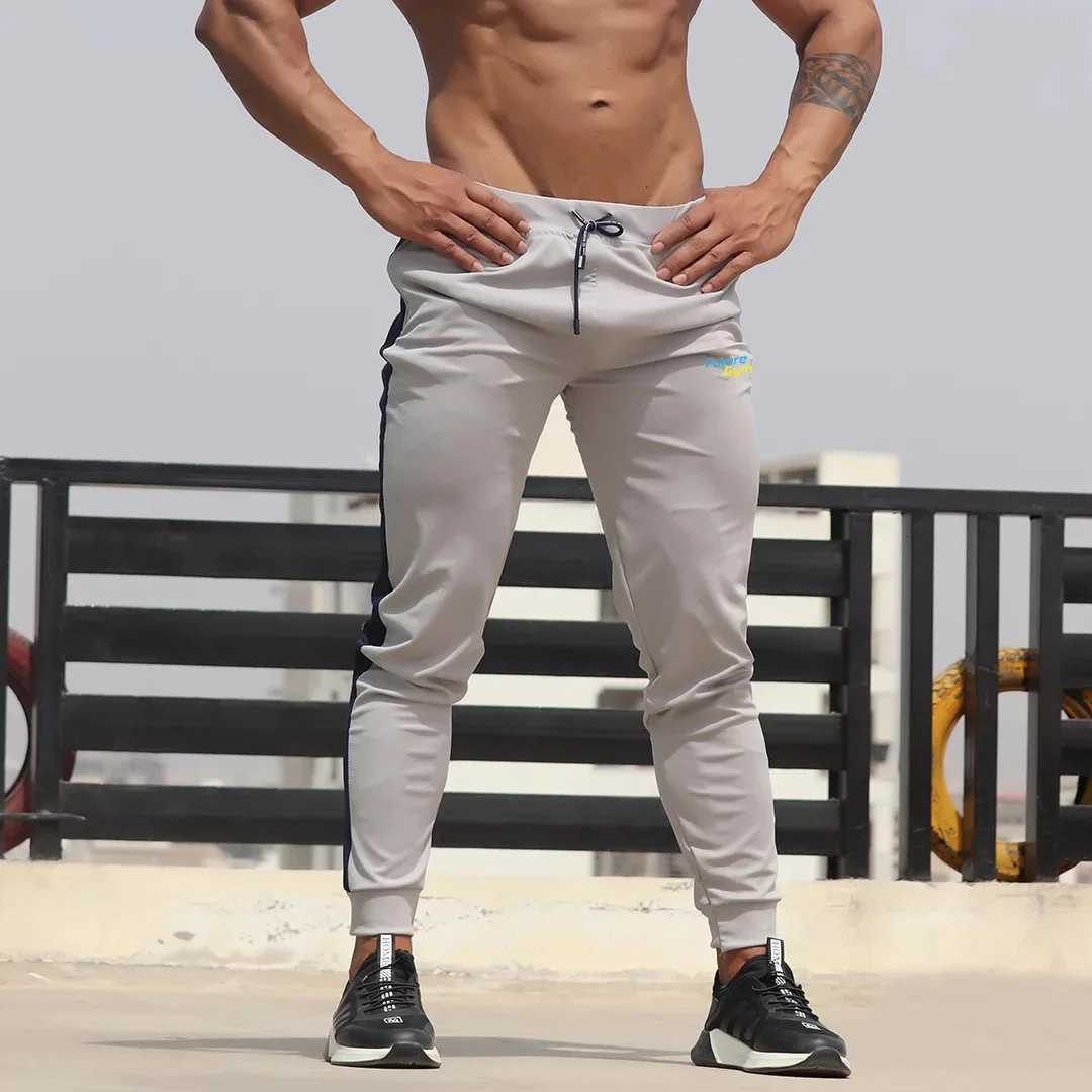 New mens color matching sports pants for running fitness leisure slim feet jogging pants cross-border between Europe and the United States W250318