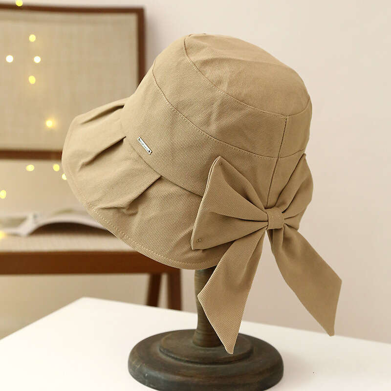 Spring and Autumn Sunscreen Women's Large brimmed UV resistant Fisherman's Hat, Korean Version Bow Casual Sun Hat