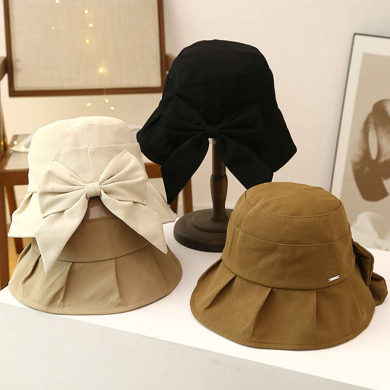 Spring and Autumn Sunscreen Women's Large brimmed UV resistant Fisherman's Hat, Korean Version Bow Casual Sun Hat