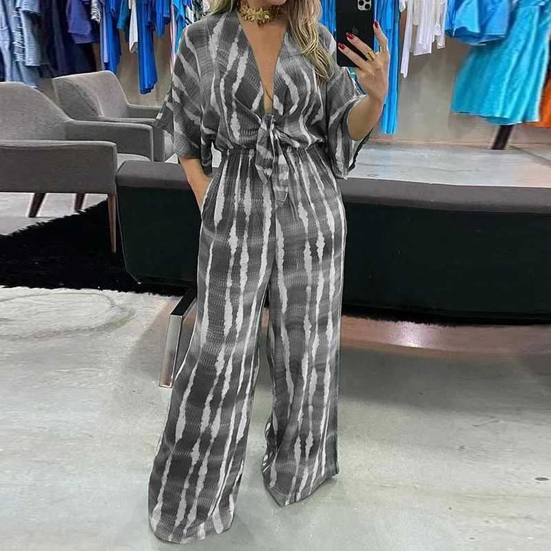 Elegant womens jumpsuit 2024 summer simple casual V-neck lace loose womens fashionable wide leg jumpsuit S-XXXL X250318