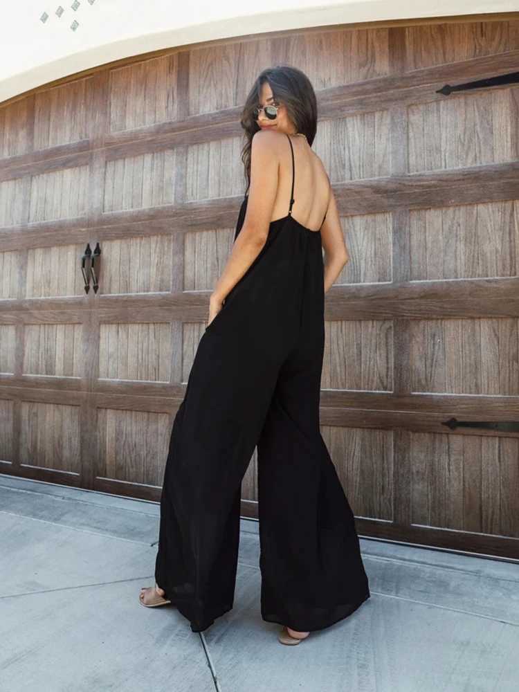 Loose wide leg American jumpsuit womens pendant summer new pocket pants casual pants womens solid straight seaside clothing X250318