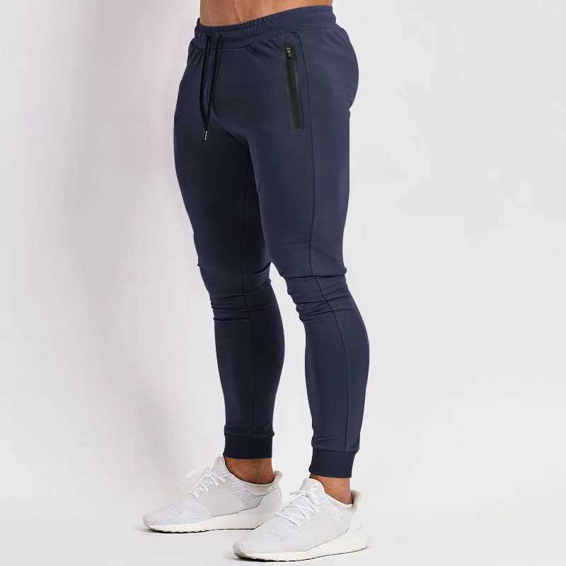European and American spring and summer new solid color lightweight fitness pants casual elastic sports pants mens fashion trend W250318