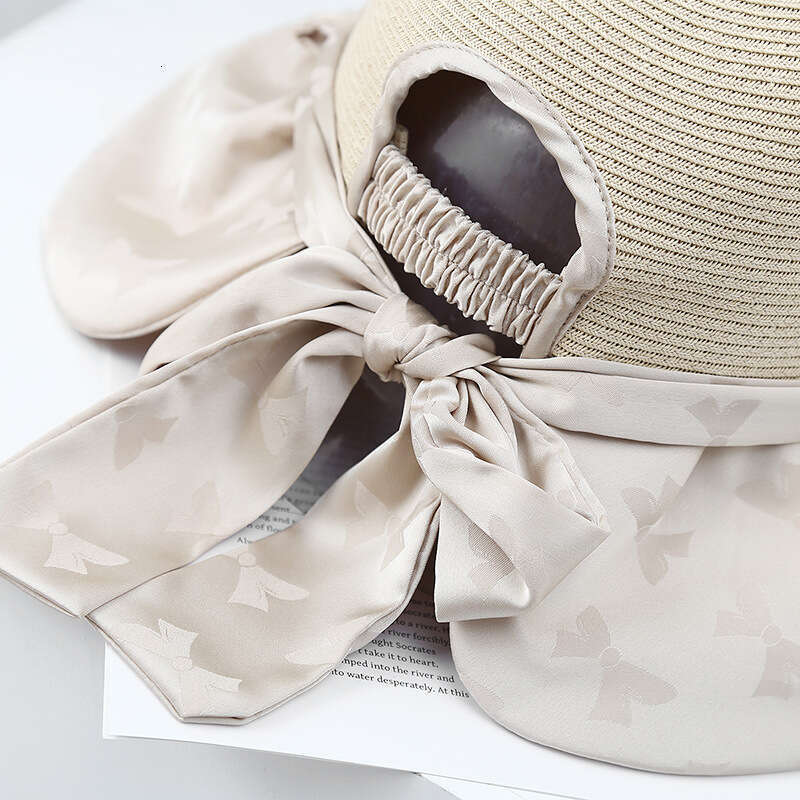 Elegant bow new style hat for women's summer travel, UV colored rubber beach sun hat, trendy