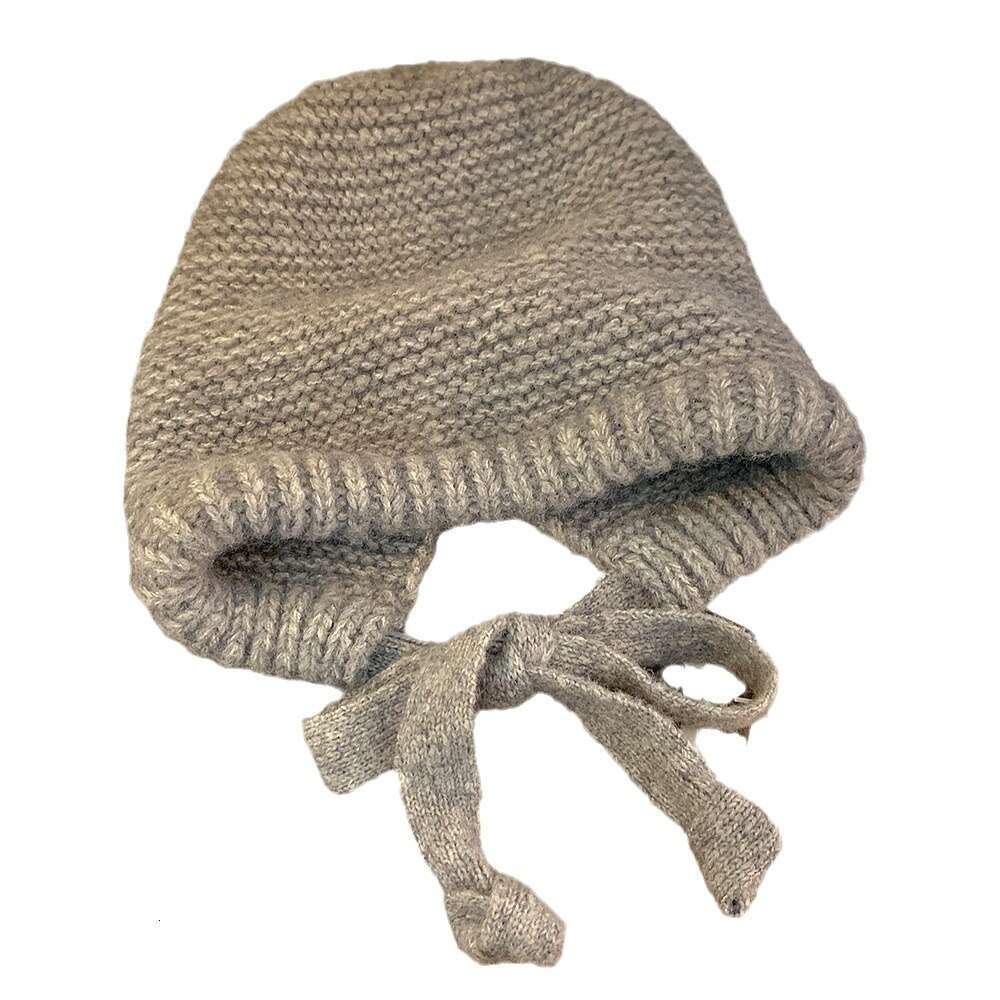 Solid color balaclava women's winter Korean version ear protection and cold proof woolen thickened warm knitted hat