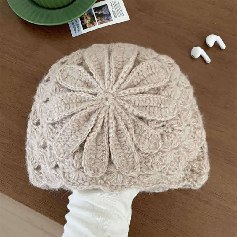 Small niche design handmade crochet yarn for women in spring and autumn, double-layer ear protection pile hat, rural air-cooled hat