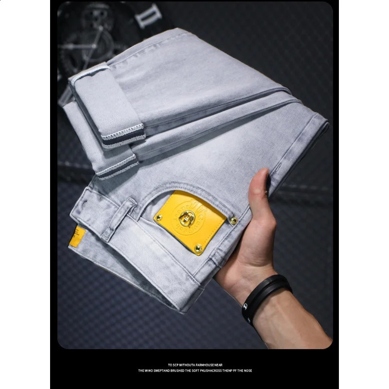 Summer thin jeans MENS light luxury quality highend and fashionable simple stretch small leather tag slim fit tapered pants 250312