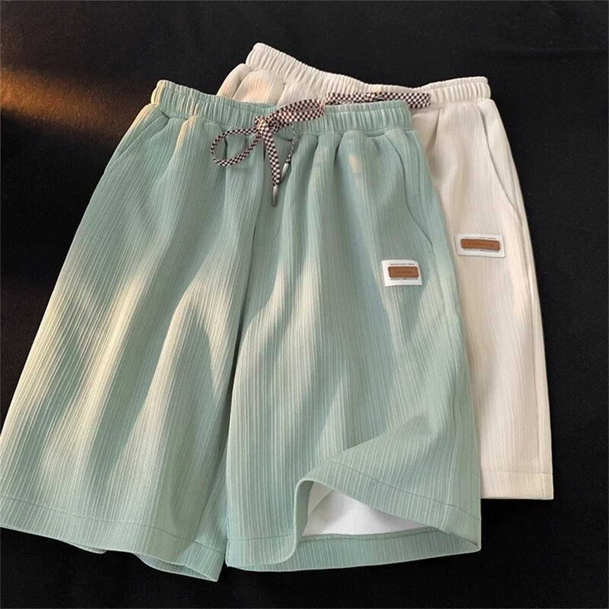 Casual solid shorts mens summer fashion and casual black pants student trend Hong Kong style gym pocket running pants mens outerwear W250319