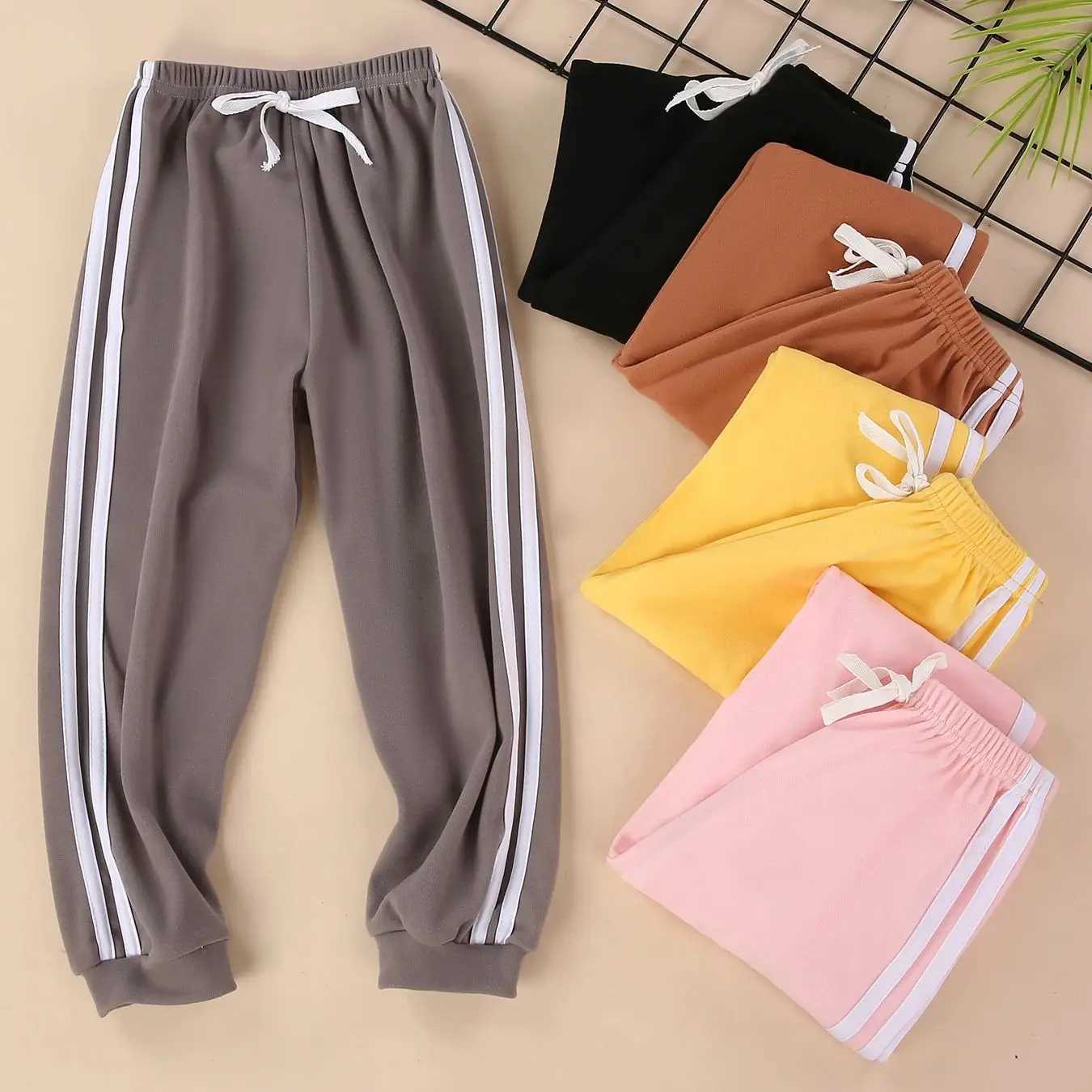 Childrens solid color sports pants for boys and girls spring and autumn casual sports clown pants elastic waist pantsT250318