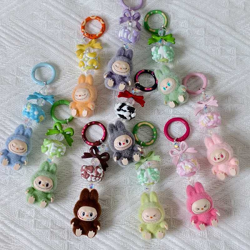 New Mini Labubu Kawaii Particle Bow Keychain Creative 3D Doll Bag Phone Charm Keychain Male and Female Gifts X250318