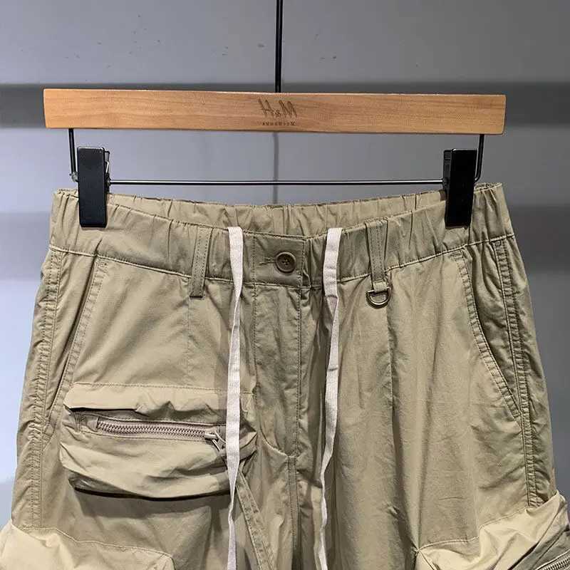 Mens summer thin casual one-fifth pants fashion brand fast drying loose pocket cargo elastic waist dragging cargo shorts W250319