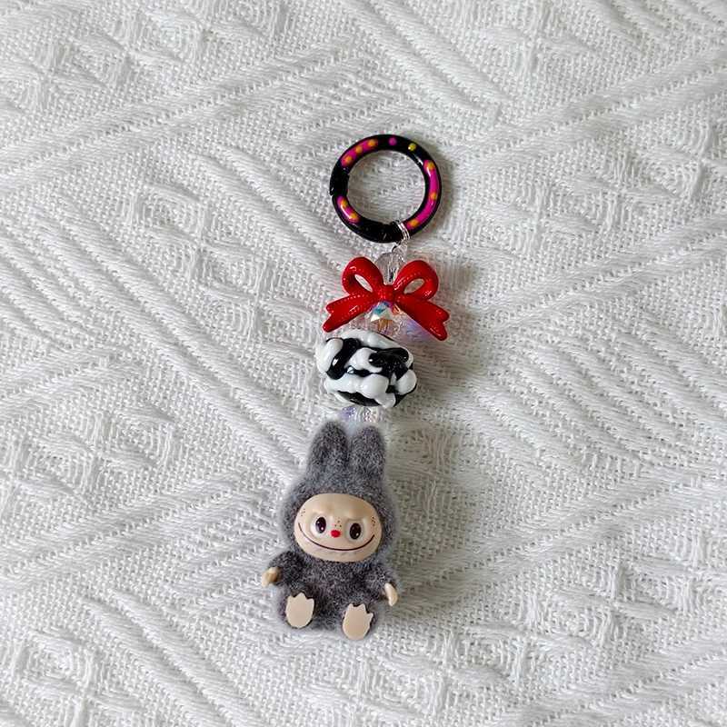 New Mini Labubu Kawaii Particle Bow Keychain Creative 3D Doll Bag Phone Charm Keychain Male and Female Gifts X250318