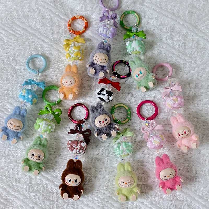 New Mini Labubu Kawaii Particle Bow Keychain Creative 3D Doll Bag Phone Charm Keychain Male and Female Gifts X250318