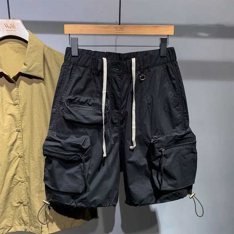 Mens summer thin casual one-fifth pants fashion brand fast drying loose pocket cargo elastic waist dragging cargo shorts W250319