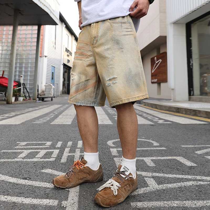 Yellow mud-dyed washed and worn-out holes straight denim cropped pants. Retro mens summer straight thin shorts are fashionable W250319