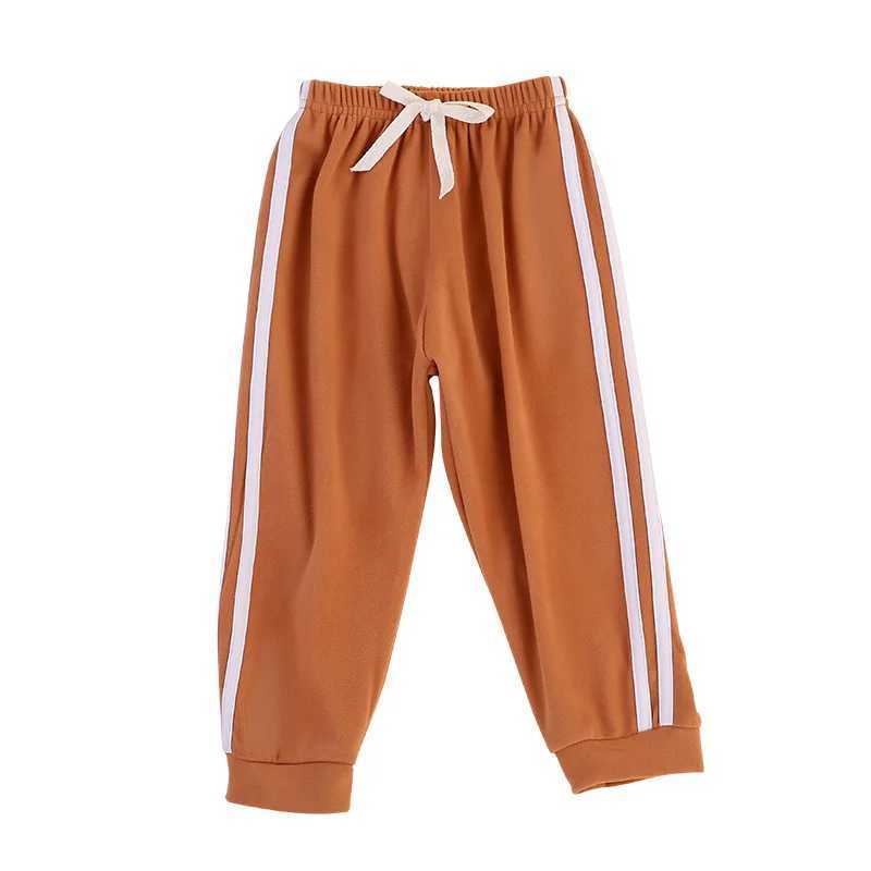 Childrens solid color sports pants for boys and girls spring and autumn casual sports clown pants elastic waist pantsT250318