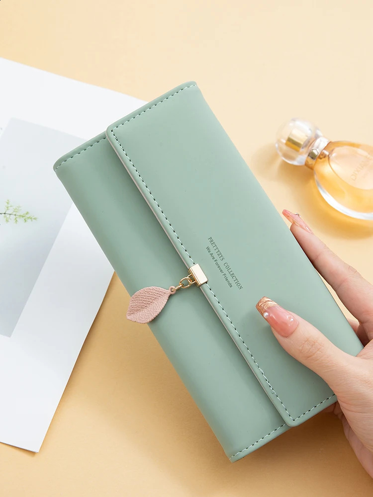 selling spring and summer womens PU leather Japanese and Korean small leaf pendant three fold bag large capacity 250318