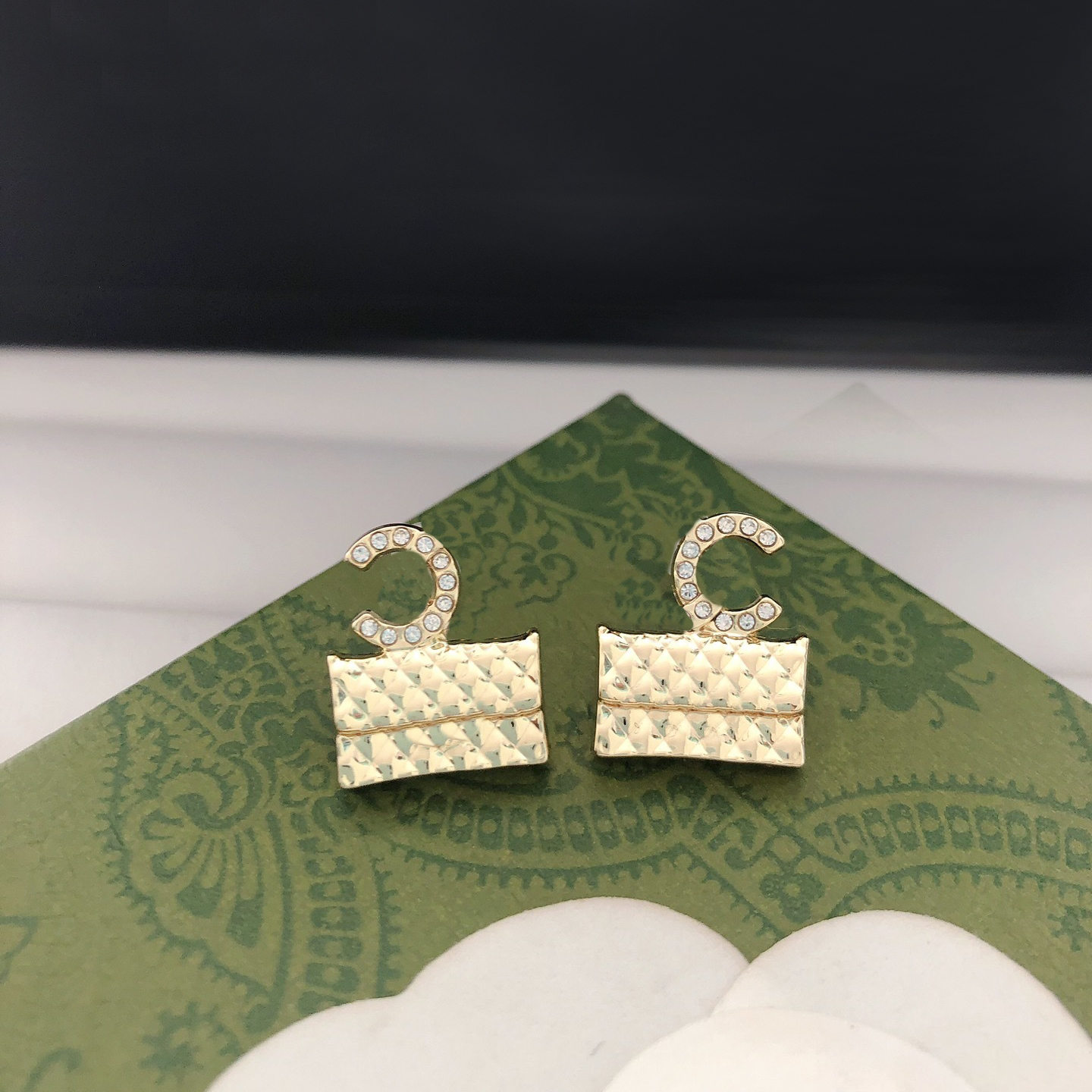 Chic Gold Tone Quilted Purse Shaped Earrings with Crystal Detailing Fashionable Jewelry for Women Trendy Accessory for Any Occasion