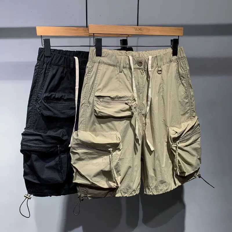 Mens summer thin casual one-fifth pants fashion brand fast drying loose pocket cargo elastic waist dragging cargo shorts W250319