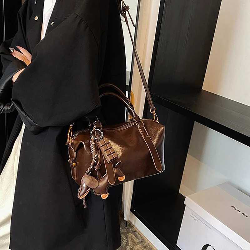 Woven rope bag pendant high-end keychain womens high-end leather sausage pendant mobile phone bag accessoriesXJ250319