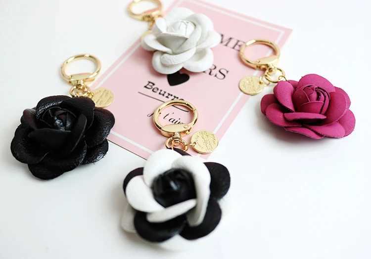 Cute synthetic PU leather rose camellia keychain suitable for women tripod keychain circular car bag pendant charm D467XJ250319